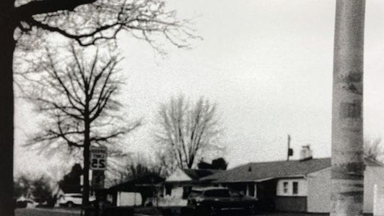 black and white photograph of a neighborhood